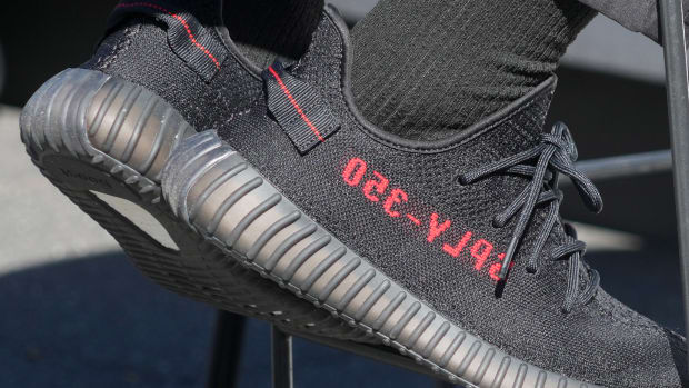 View of black and red adidas Yeezy shoes.